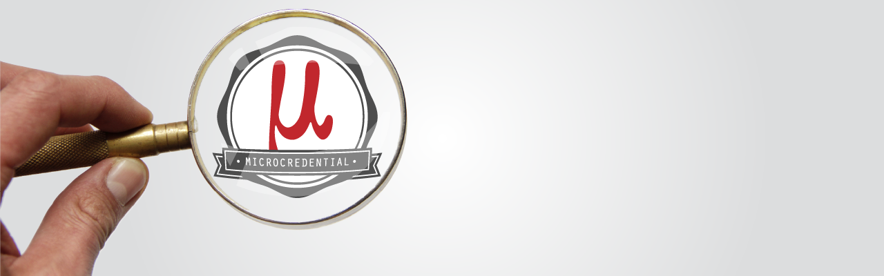 Microcredntial logo under a magnifying glass.